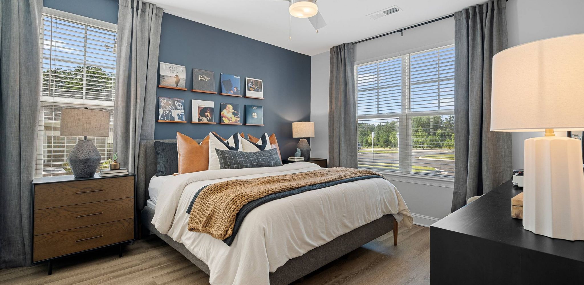 Hawthorne at the Forest spacious apartment bedroom with wood floors and large windows
